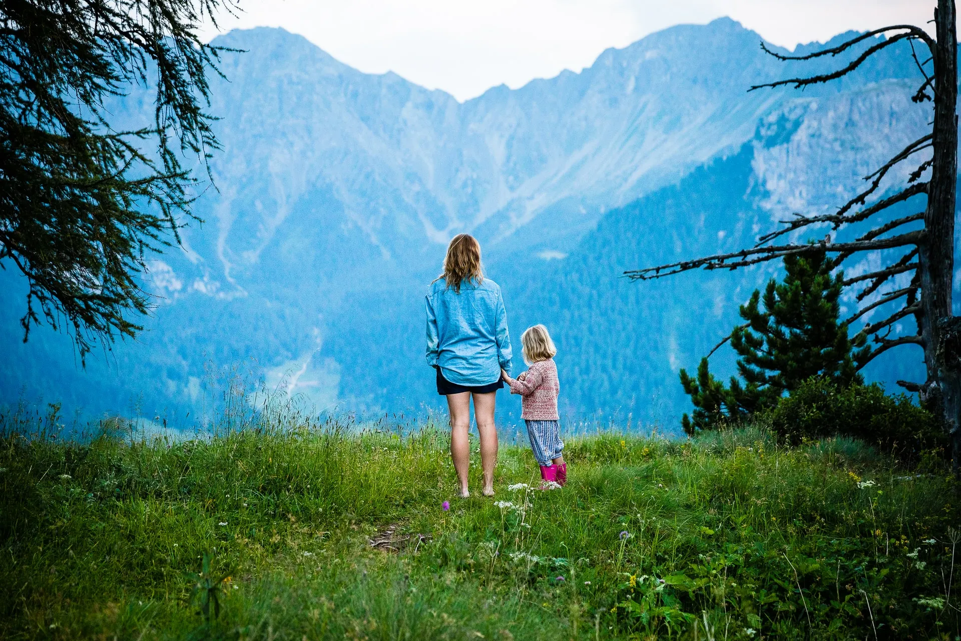 woman and child by the mountains